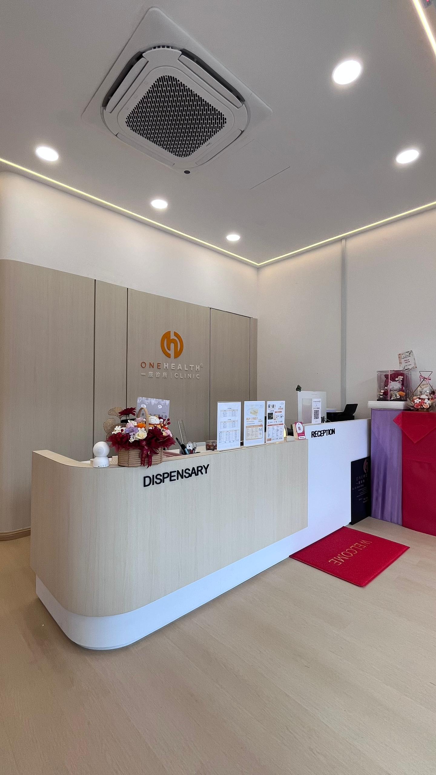Reception and dispensary desk at OneHealth Clinic Pontian